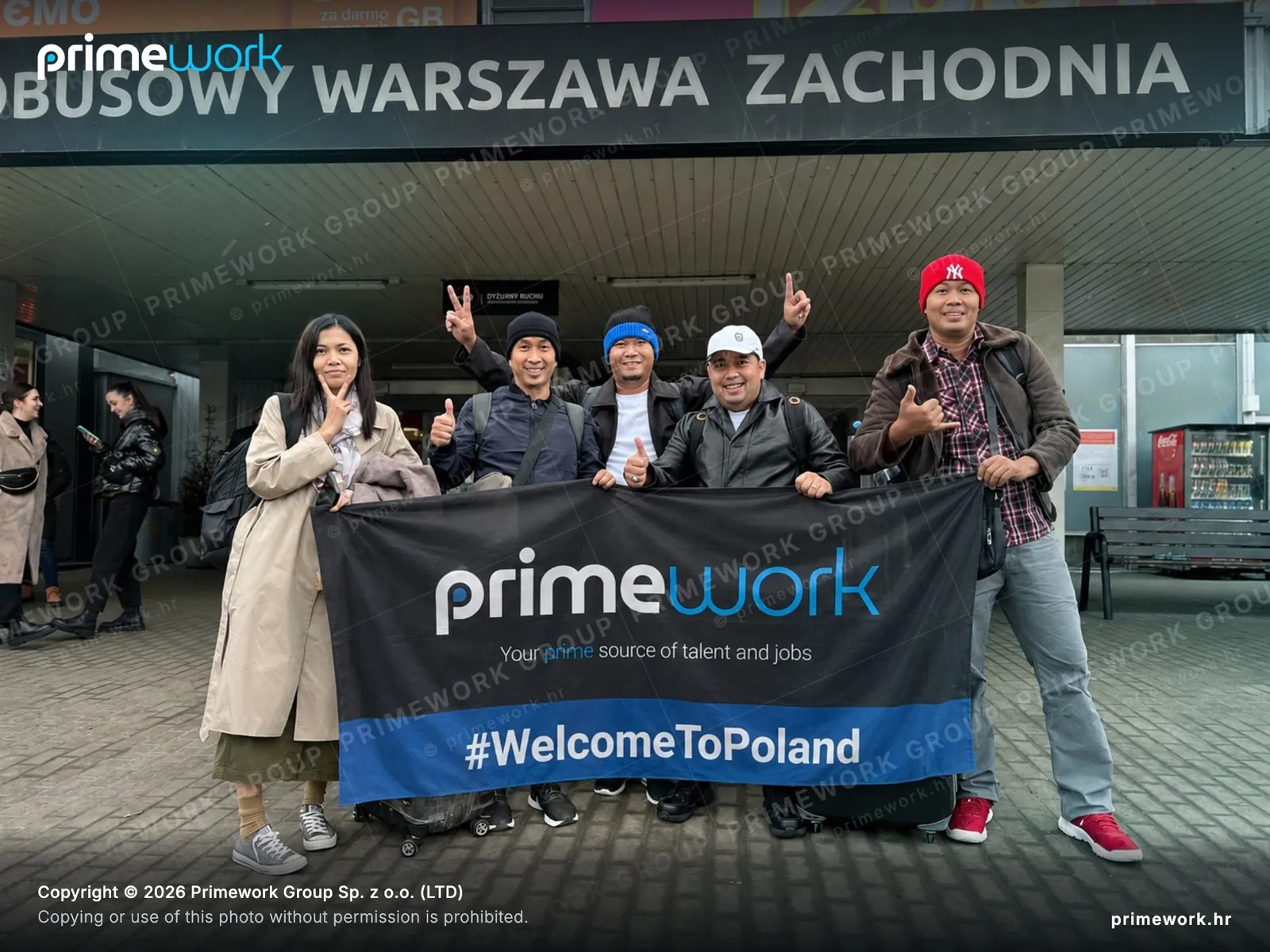 A group of foreign workers with luggage at Warsaw West station
